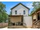 Charming backyard view highlighting the home's siding, back porch, and cozy string lights at 1228 Ladd Sw St, Atlanta, GA 30310