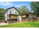 A backyard with two porches, trees, and plenty of yard space on a sunny day at 1228 Ladd Sw St, Atlanta, GA 30310