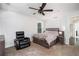 Bedroom with carpeting, ceiling fan, chair, side table, and queen-sized bed at 1228 Ladd Sw St, Atlanta, GA 30310