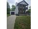 Charming two-story home with a large front yard, two porches, and an attached garage at 1228 Ladd Sw St, Atlanta, GA 30310