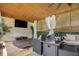 Relaxing hot tub area with mounted TV, ambient lighting, and comfortable seating in an outdoor entertaining space at 1228 Ladd Sw St, Atlanta, GA 30310