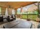 Relaxing outdoor patio featuring a hot tub, comfortable seating, and a stylish lattice ceiling with a fan at 1228 Ladd Sw St, Atlanta, GA 30310