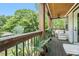 Wooden porch with ceiling fan and seating with a railing and view of yard at 1228 Ladd Sw St, Atlanta, GA 30310