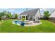 Expansive backyard featuring a large gunite pool, hot tub, patio, and lush landscaping at 1974 Hosack Sw Hl, Marietta, GA 30064