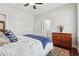 Bright bedroom with a ceiling fan, a wooden dresser and ensuite bathroom at 1974 Hosack Sw Hl, Marietta, GA 30064