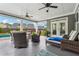 Relaxing covered patio with ceiling fans, lounge chairs, and comfortable seating area at 1974 Hosack Sw Hl, Marietta, GA 30064