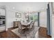 Elegant dining room featuring a chandelier, stylish rug, and wainscoting details at 1974 Hosack Sw Hl, Marietta, GA 30064