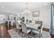 Stylish dining room with elegant chandelier and views of the gourmet kitchen at 1974 Hosack Sw Hl, Marietta, GA 30064