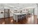 Gourmet kitchen with a large island and seating, stainless steel appliances, and easy access to dining area at 1974 Hosack Sw Hl, Marietta, GA 30064