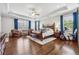 Spacious main bedroom with tray ceiling, hardwood floors, and lots of natural light at 1974 Hosack Sw Hl, Marietta, GA 30064