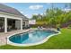 Beautiful backyard with a sparkling pool, hot tub, and well-manicured landscaping at 1974 Hosack Sw Hl, Marietta, GA 30064