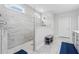 Luxurious walk-in shower with marble tiling and glass enclosure in the bathroom at 1974 Hosack Sw Hl, Marietta, GA 30064