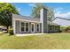 Well-kept backyard, features a concrete patio, lush lawn, and modern siding at 231 Clarion Rd, Lawrenceville, GA 30043