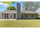 House's exterior with an expansive yard and a neutral siding and a view of the patio at 231 Clarion Rd, Lawrenceville, GA 30043