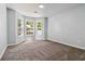 Comfortable bedroom with bay window, carpet, and neutral color scheme at 231 Clarion Rd, Lawrenceville, GA 30043