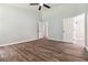 Bright bedroom with wood-look floors with attached bath and walk in closet at 231 Clarion Rd, Lawrenceville, GA 30043