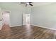 Large bedroom featuring wood-look floors and ample natural light at 231 Clarion Rd, Lawrenceville, GA 30043
