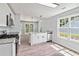 Bright kitchen boasts stainless appliances, granite counters and ample natural light from large windows at 231 Clarion Rd, Lawrenceville, GA 30043