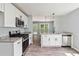Modern kitchen features stainless steel appliances, granite countertops, and an open layout at 231 Clarion Rd, Lawrenceville, GA 30043