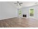 Bright living room features a fireplace, ample natural light, and wood-look flooring at 231 Clarion Rd, Lawrenceville, GA 30043