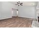 Inviting living room featuring wood-look flooring, neutral walls, and great natural light at 231 Clarion Rd, Lawrenceville, GA 30043