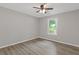 Bedroom features a ceiling fan and a window at 3216 Montheath Ct, Duluth, GA 30096
