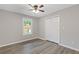 This bedroom includes a ceiling fan, closet and great lighting at 3216 Montheath Ct, Duluth, GA 30096