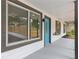 Inviting covered front porch featuring a bright blue door, white siding, and neutral trim, perfect for enjoying quiet moments at 3216 Montheath Ct, Duluth, GA 30096