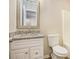 Full bathroom with a toilet and vanity with stone countertop at 50 Fieldview Ln, Covington, GA 30016