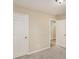 A spacious bedroom with neutral carpet and access to closets at 50 Fieldview Ln, Covington, GA 30016
