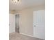 A clean bedroom with two doors and neutral carpeting at 50 Fieldview Ln, Covington, GA 30016