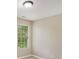 A well-lit bedroom featuring neutral walls and carpeted floors at 50 Fieldview Ln, Covington, GA 30016