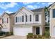 Charming two-story home featuring a one-car garage and beautifully maintained front yard at 50 Fieldview Ln, Covington, GA 30016