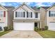 Charming two-story home featuring a one-car garage and beautifully maintained front yard at 50 Fieldview Ln, Covington, GA 30016