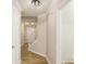 Inviting hallway with light wood floors, white trim and access to the stairs and downstairs rooms at 50 Fieldview Ln, Covington, GA 30016
