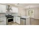 Bright eat-in kitchen features stainless appliances, granite counters and an adjacent dining area at 50 Fieldview Ln, Covington, GA 30016