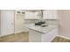 Bright, modern kitchen with white cabinets, granite countertops, and stainless steel appliances at 50 Fieldview Ln, Covington, GA 30016