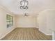A large open living room with wood-look floors and a large window at 50 Fieldview Ln, Covington, GA 30016