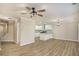 Open-concept living room and kitchen with modern lighting and beautiful flooring at 50 Fieldview Ln, Covington, GA 30016