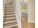 Elegant staircase leading to an open living area at 50 Fieldview Ln, Covington, GA 30016