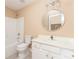 Bathroom with a tiled floor, vanity, mirror, and tub-shower combo at 7406 Cherry Blossom Way, Winston, GA 30187