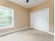 Bedroom featuring a closet with paneled doors at 7406 Cherry Blossom Way, Winston, GA 30187