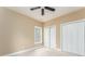 Bedroom featuring a ceiling fan and double door closet at 7406 Cherry Blossom Way, Winston, GA 30187