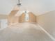 Spacious bonus room with vaulted ceilings and a window at 7406 Cherry Blossom Way, Winston, GA 30187