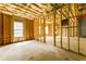 Unfinished room featuring a concrete floor, exposed walls, and windows at 7406 Cherry Blossom Way, Winston, GA 30187