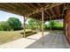 Covered back patio offers shade in fenced backyard, and ready for outdoor entertaining at 9157 Golfview Cir, Covington, GA 30014