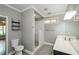 Modern bathroom with double sink, and updated shower at 9157 Golfview Cir, Covington, GA 30014