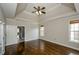 Large bedroom features hardwood floors, a tray ceiling, and abundant natural light at 9157 Golfview Cir, Covington, GA 30014