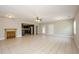 Spacious living room shows tile flooring, a ceiling fan, and an open floor plan at 9157 Golfview Cir, Covington, GA 30014