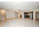 Open-concept living space features tile floors, ceiling fan, and easy access to kitchen at 9157 Golfview Cir, Covington, GA 30014